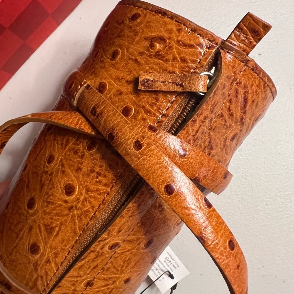 DKNY leather cylindrical shape.